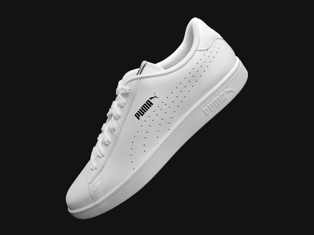Water droplets beading up and rolling off nano-treated sneaker leather surface